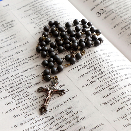 Image of rosary on bible